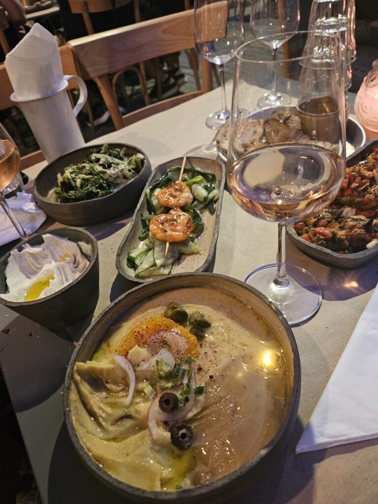 Dinner in Greece, several dishes and wine