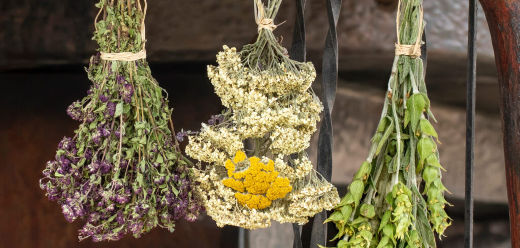 herbs drying in the sun infront of a greek village home door