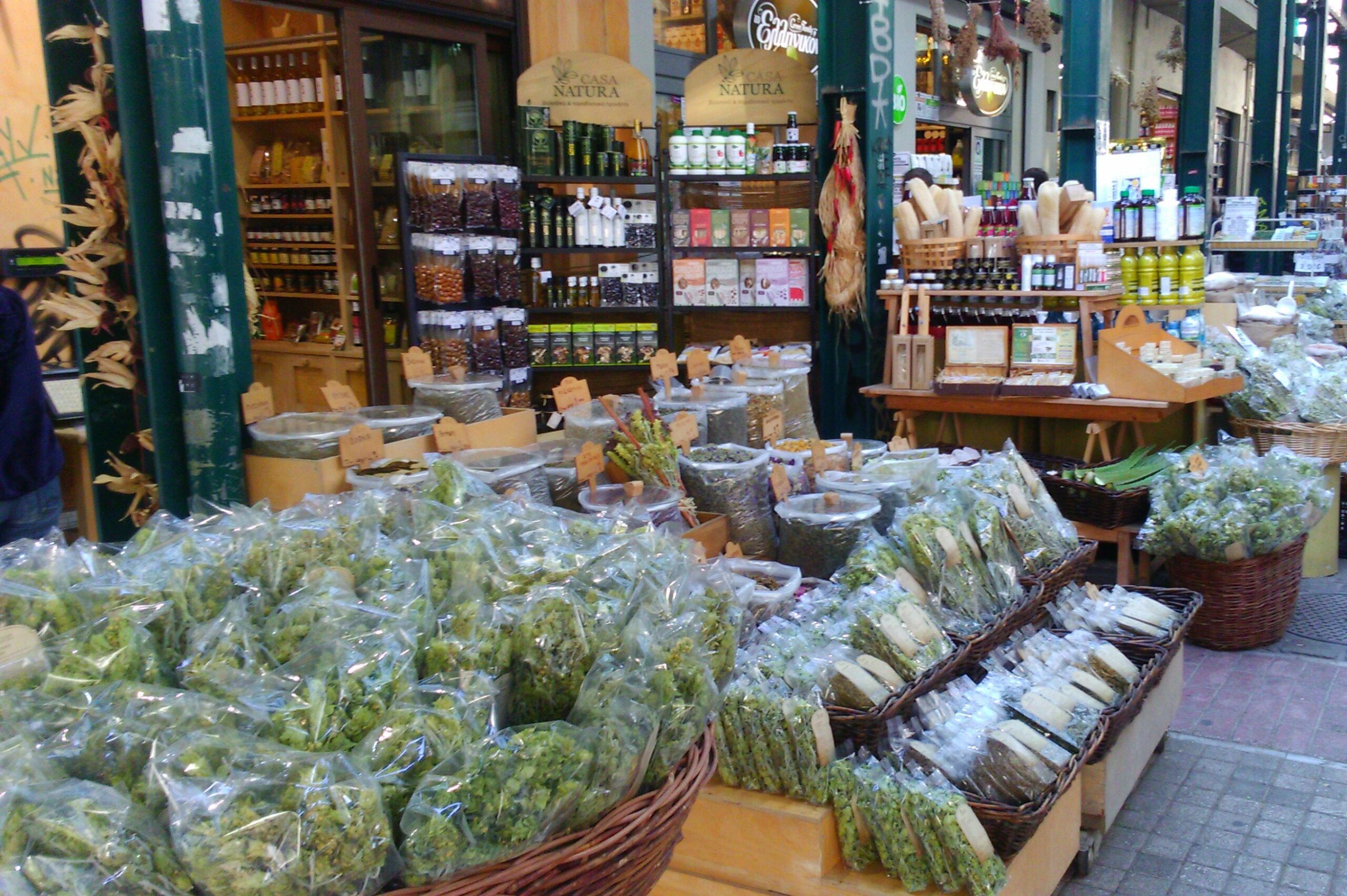 Open air spice market with greens, olives and greek products